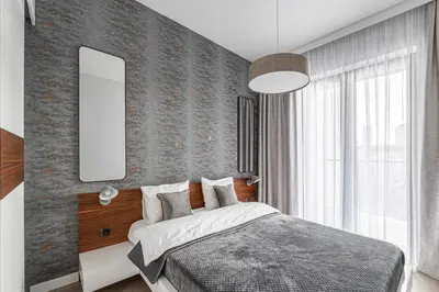 Łóżko lub łóżka w pokoju w obiekcie CHRONOS APARTAMENTY with Parking and Air Conditioning in Warsaw Wola by Renters Prestige