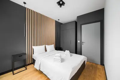 Łóżko lub łóżka w pokoju w obiekcie Praga Południe Chic Apartment by BookingHost