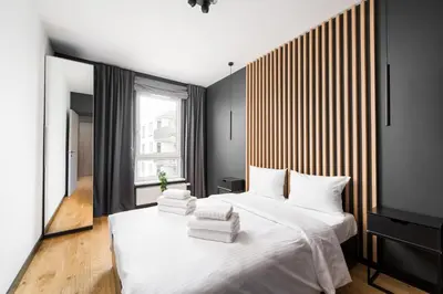 Łóżko lub łóżka w pokoju w obiekcie Praga Południe Chic Apartment by BookingHost