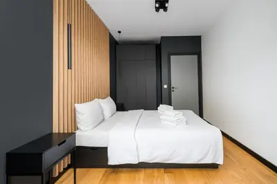 Łóżko lub łóżka w pokoju w obiekcie Praga Południe Chic Apartment by BookingHost
