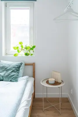 Łóżko lub łóżka w pokoju w obiekcie Chmielna Central Apartments