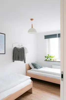 Łóżko lub łóżka w pokoju w obiekcie Chmielna Central Apartments