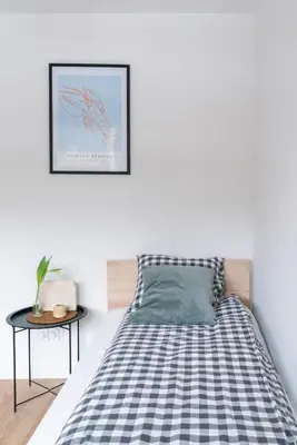 Łóżko lub łóżka w pokoju w obiekcie Chmielna Central Apartments