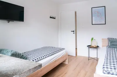 Łóżko lub łóżka w pokoju w obiekcie Chmielna Central Apartments