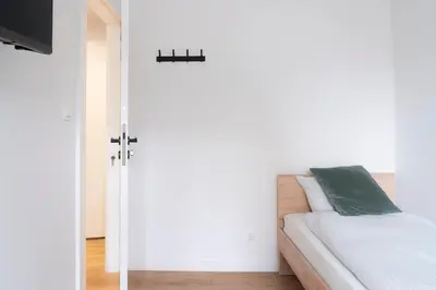 Łóżko lub łóżka w pokoju w obiekcie Chmielna Central Apartments