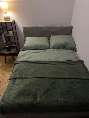 Łóżko lub łóżka w pokoju w obiekcie Zielona Ochota