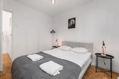 Łóżko lub łóżka w pokoju w obiekcie Sobieskiego 70 by Homeprime