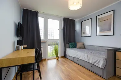 Łóżko lub łóżka w pokoju w obiekcie ROOMs Krochmalna 3