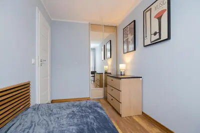Łóżko lub łóżka w pokoju w obiekcie ROOMs Krochmalna 3