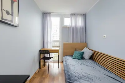 Łóżko lub łóżka w pokoju w obiekcie ROOMs Krochmalna 3