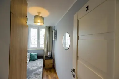 Łóżko lub łóżka w pokoju w obiekcie ROOMs Krochmalna 3