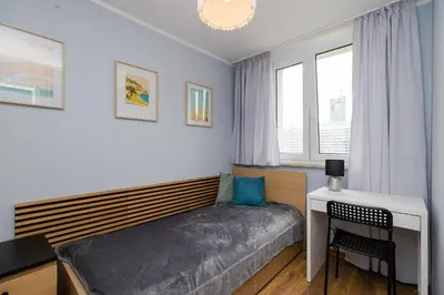 Łóżko lub łóżka w pokoju w obiekcie ROOMs Krochmalna 3