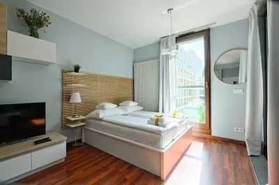 Łóżko lub łóżka w pokoju w obiekcie ApartHotel Warsaw Center