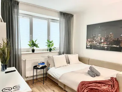 Łóżko lub łóżka w pokoju w obiekcie Apartel24pl Mozart Apartments