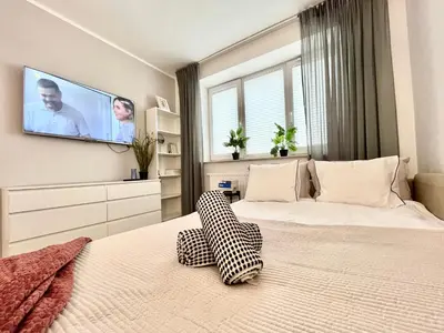 Łóżko lub łóżka w pokoju w obiekcie Apartel24pl Mozart Apartments