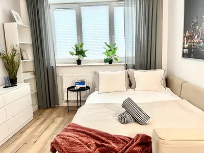 Łóżko lub łóżka w pokoju w obiekcie Apartel24pl Mozart Apartments