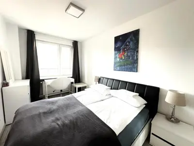 Łóżko lub łóżka w pokoju w obiekcie OhMyHome Panorama Apartament w Centrum Warszawy z widokiem na Pałac Kultury