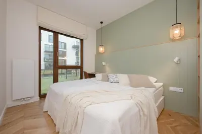 Łóżko lub łóżka w pokoju w obiekcie LUX Pastel Oasis Family Apartment with Parking & Gym by Renters Prestige