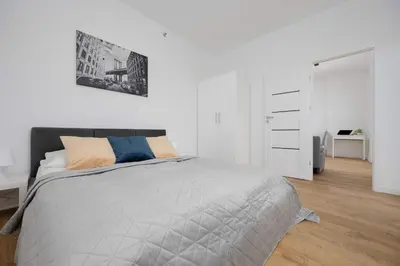 Łóżko lub łóżka w pokoju w obiekcie Apartment Kasprzaka near Metro Płocka with AC by Noclegi Renters
