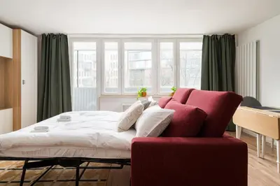 Łóżko lub łóżka w pokoju w obiekcie Warszawa Wileńska Deluxe Studio by BookingHost