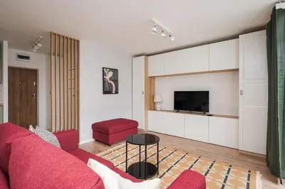 Telewizja i/lub zestaw kina domowego w obiekcie Warszawa Wileńska Deluxe Studio by BookingHost