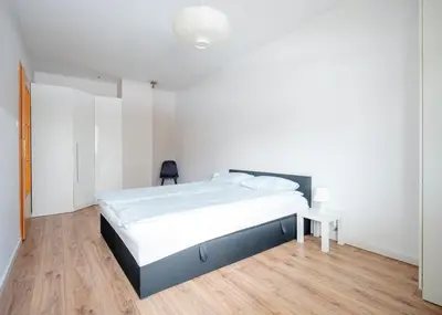 Łóżko lub łóżka w pokoju w obiekcie Green Kabaty Apartment 5