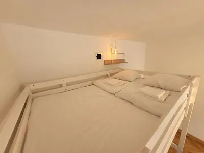 Łóżko lub łóżka w pokoju w obiekcie Apart Blisko