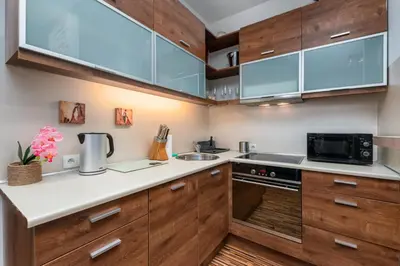 Kuchnia lub aneks kuchenny w obiekcie Obrzeżna 1A by Homeprime
