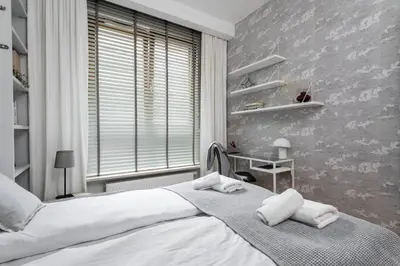 Łóżko lub łóżka w pokoju w obiekcie Aura Premium Apartment Mokotow