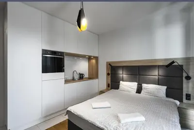 Łóżko lub łóżka w pokoju w obiekcie Moduo by Executive Suites