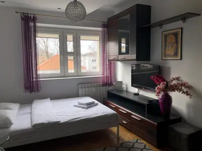 Łóżko lub łóżka w pokoju w obiekcie Plac Bankowy Apartment, Metro