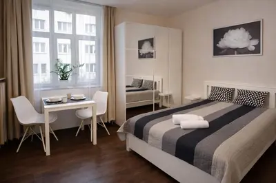 Łóżko lub łóżka w pokoju w obiekcie Comfort Apartments Warsaw near Central Station on Złota Street