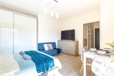Łóżko lub łóżka w pokoju w obiekcie SuperApart Wileńska apt 7 - Komfortowe studio Praga