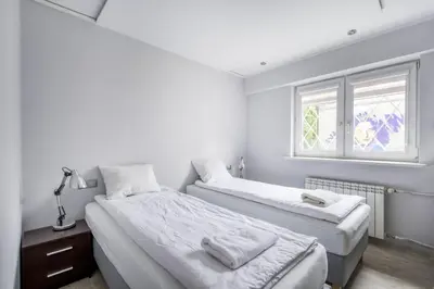 Łóżko lub łóżka w pokoju w obiekcie Labo Apartment Smocza