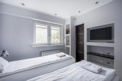 Łóżko lub łóżka w pokoju w obiekcie Labo Apartment Smocza