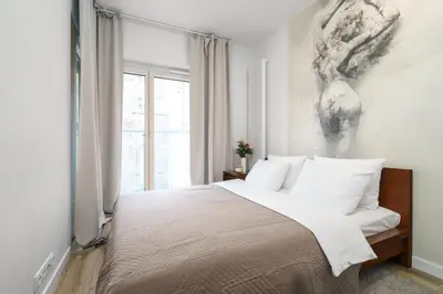 Łóżko lub łóżka w pokoju w obiekcie Golden Apartments - Mennica Residence, 1-Bedroom in City Center #3