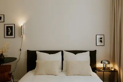 Łóżko lub łóżka w pokoju w obiekcie Poznanska Studio