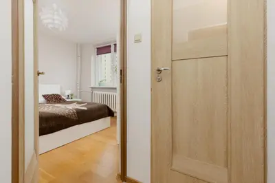 Łóżko lub łóżka w pokoju w obiekcie Bright Apartment Bogusławskiego Perfect for Remote Work by Noclegi Renters