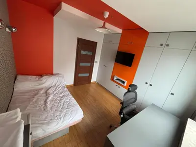 Łóżko lub łóżka w pokoju w obiekcie Apartament Praga Północ