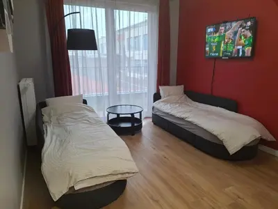 Łóżko lub łóżka w pokoju w obiekcie Heron Apartment