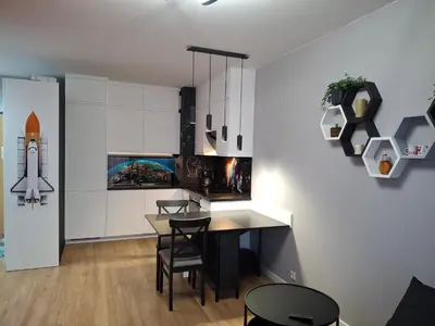 Telewizja i/lub zestaw kina domowego w obiekcie Heron Apartment