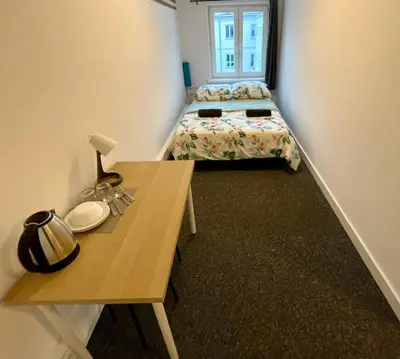 Łóżko lub łóżka w pokoju w obiekcie Fantastic-Inn Warszawa - Chmielna