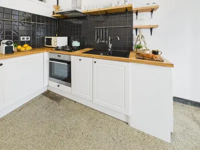 Kuchnia lub aneks kuchenny w obiekcie Cosy Studio Kasprowicza in Warsaw by Noclegi Renters