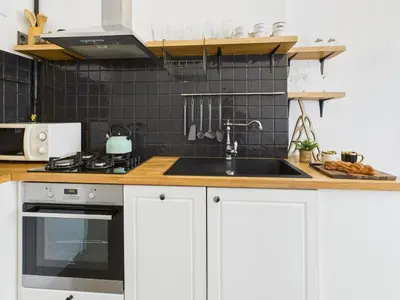Kuchnia lub aneks kuchenny w obiekcie Cosy Studio Kasprowicza in Warsaw by Noclegi Renters