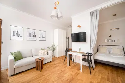 Łóżko lub łóżka w pokoju w obiekcie Park Praski Deluxe Studio by BookingHost