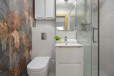 Łazienka w obiekcie Bright Apartment with Air Conditioning in the Capital by Noclegi Renters