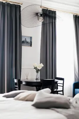 Łóżko lub łóżka w pokoju w obiekcie Boutique Studio, 5-minute walk to Stadion Narodowy Metro
