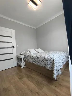 Łóżko lub łóżka w pokoju w obiekcie Apartament Old Town Floriańska