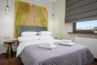 Łóżko lub łóżka w pokoju w obiekcie P&O Apartments Belvedere Residence