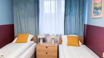 Łóżko lub łóżka w pokoju w obiekcie Blue Apartment with balcony - self check-in